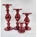 red colored large glass candlestick holder